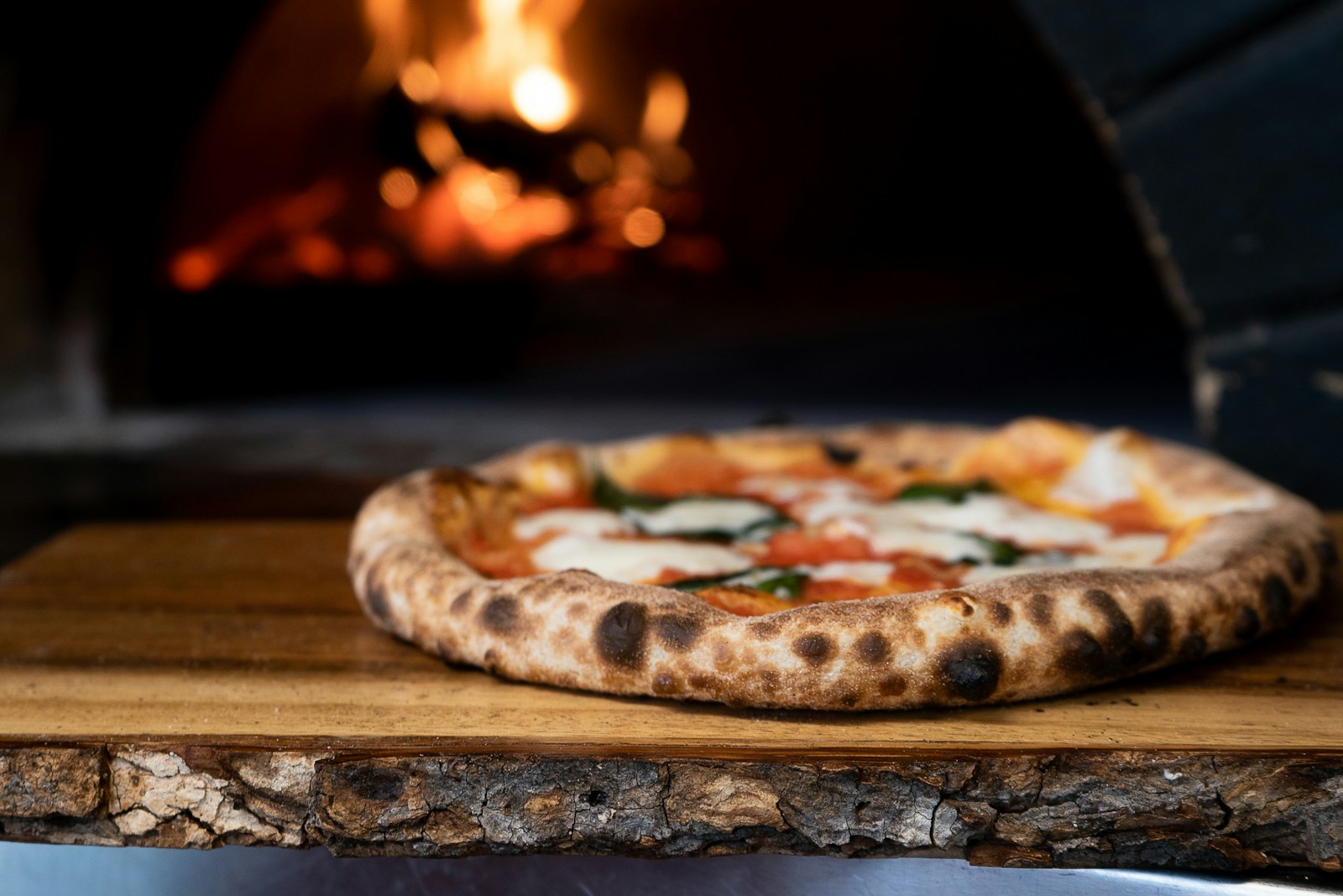 Photo by Nik Owens pizza on brown wooden table